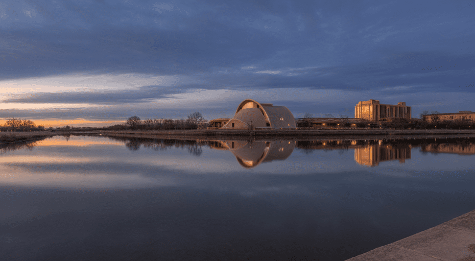 San Angelo Texas skyline at dusk over river.